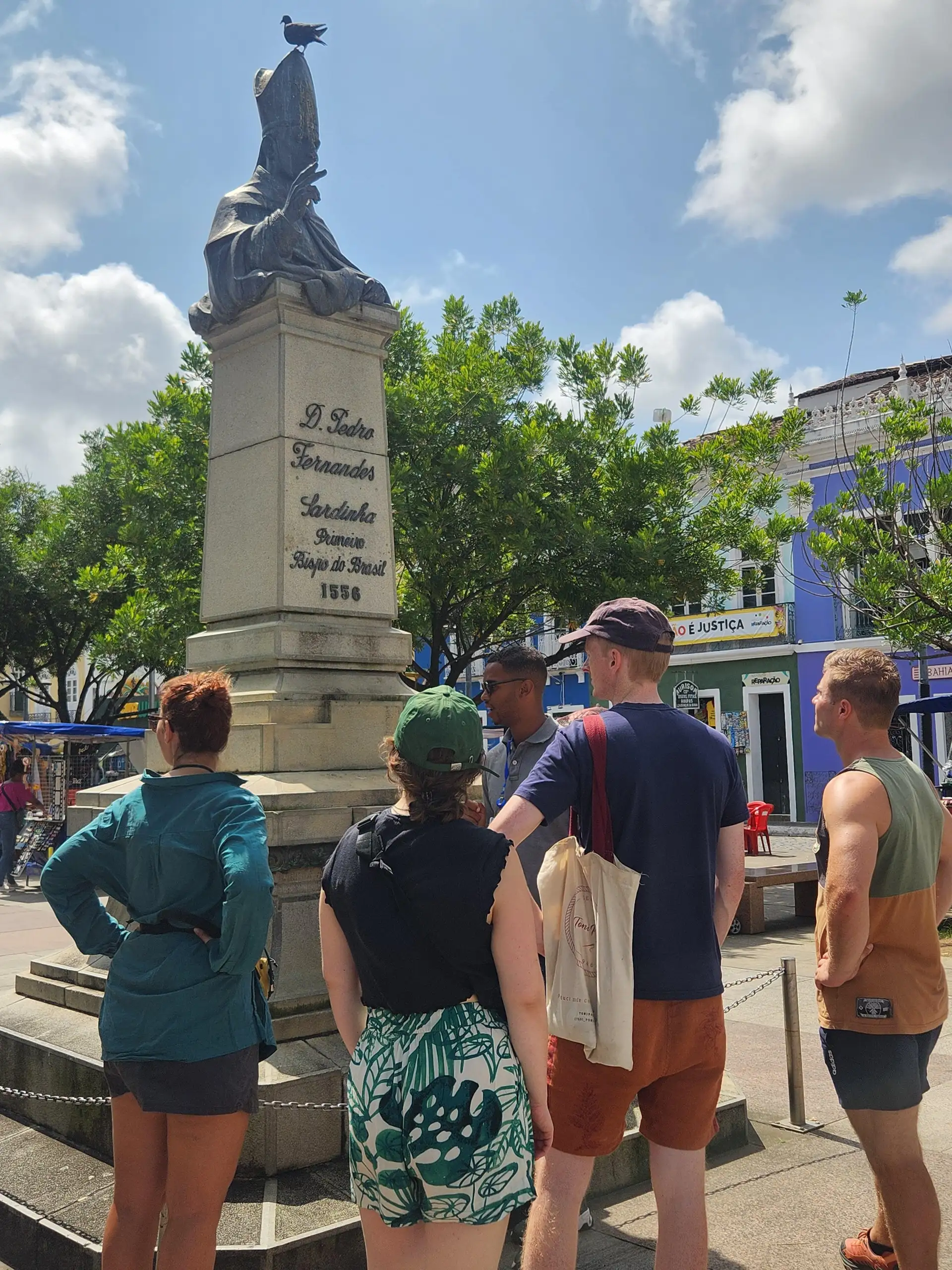 Tour group exploring the historic center of Salvador with a local guide